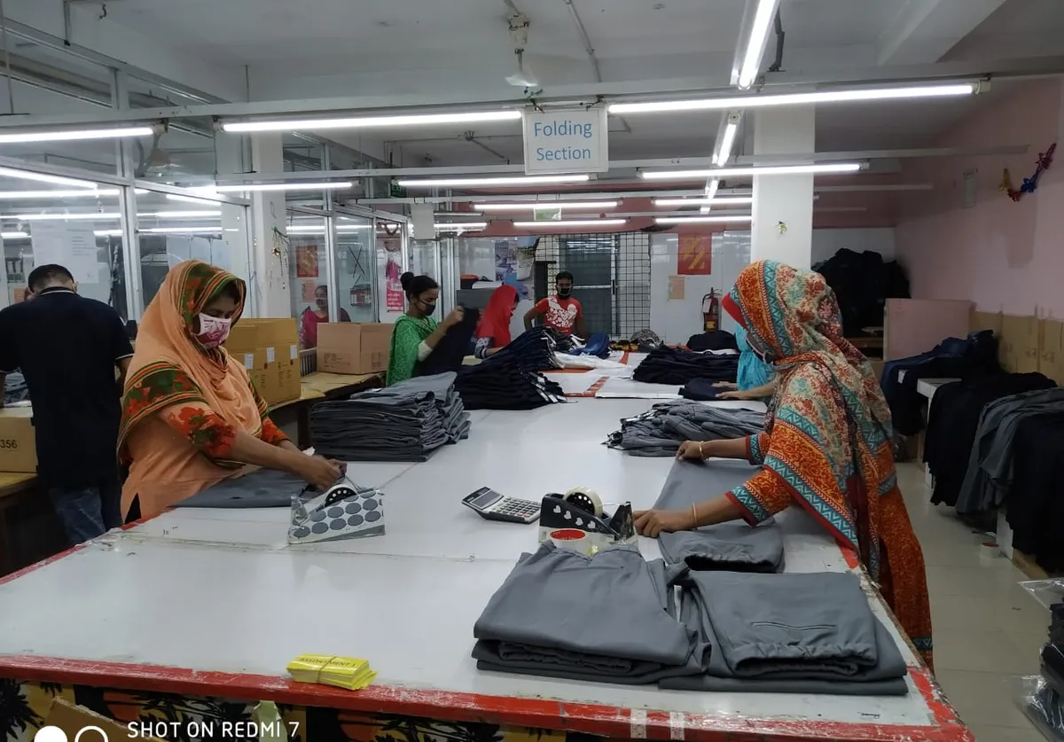 Garments being checked at the quality table