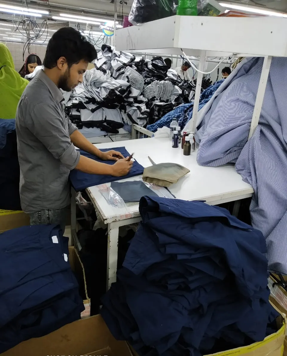 Folding sample garments in the showroom