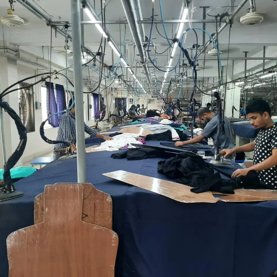 Sweater and garment finishing & ironing section inside the Essential Group factory in Khilkhet, Dhaka, Bangladesh