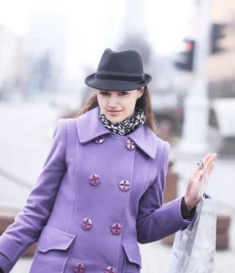 portrait-smiling-woman-with-shopping-blurred-city-background